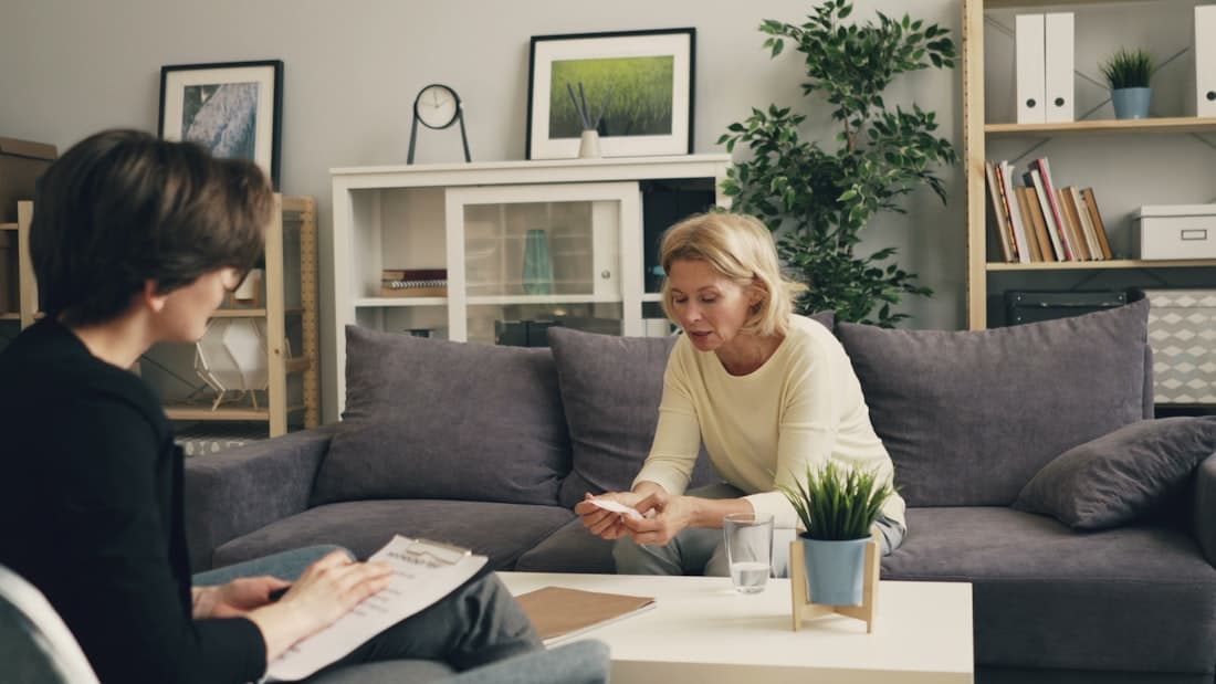 A coordinator listening to a family at home